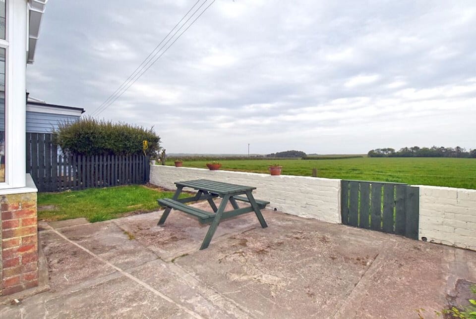 Rear terrace with views over fields