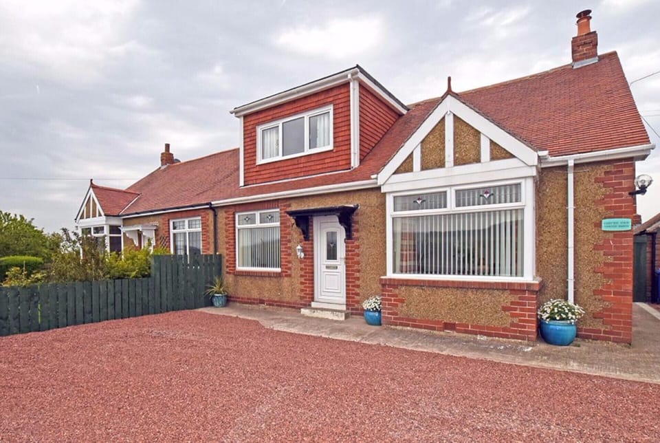 Front exterior with parking for up to 5 cars