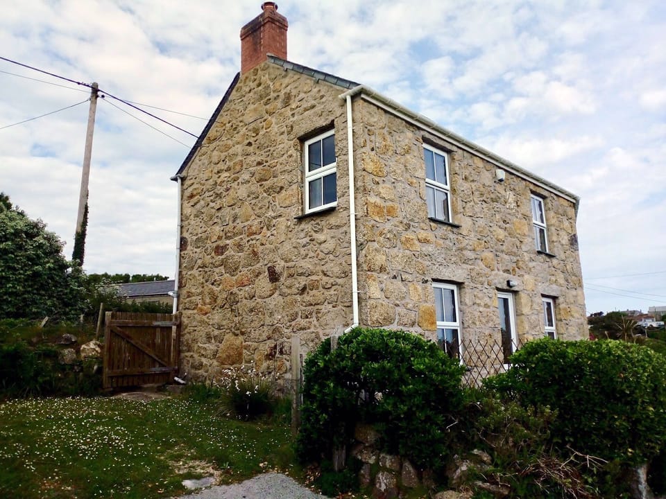 House and parking spot on Left
