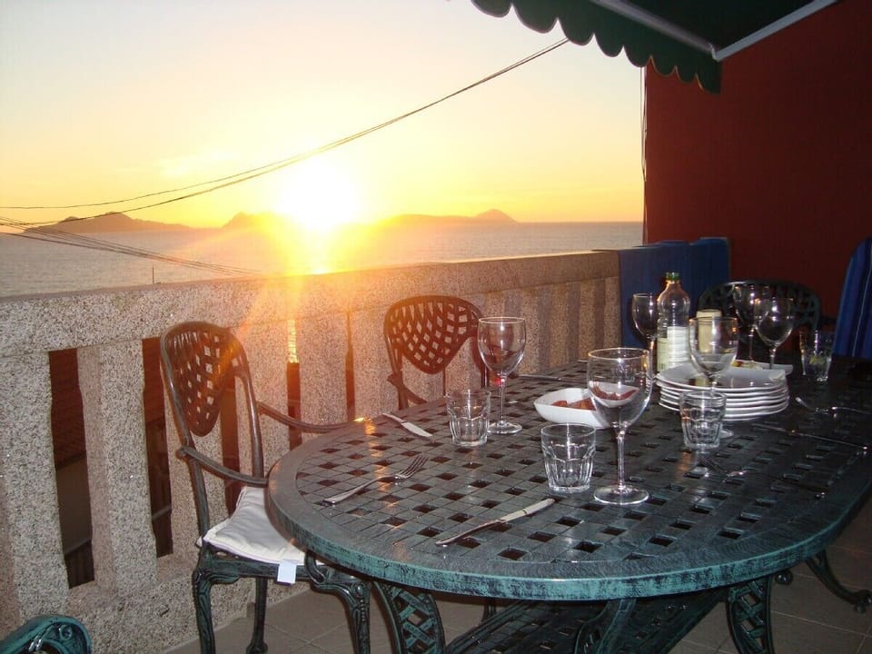 Table laid for dinner on the upstairs terrace