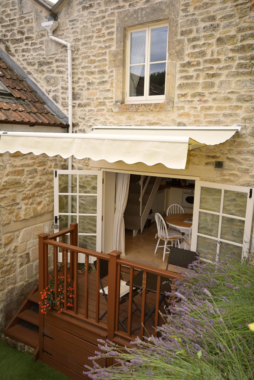 Sunny garden with an 
awning to protect from the sun or a shower