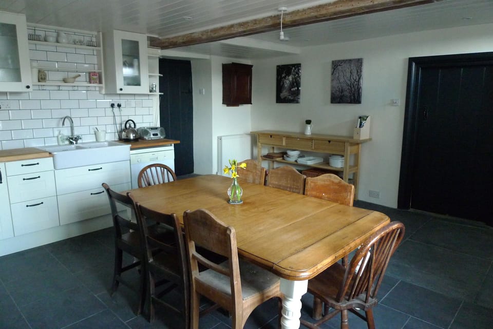 the large family kitchen seats 8 and is the heart of the house