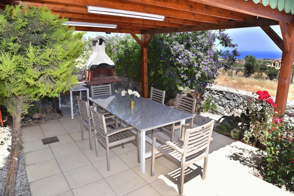 Pergola, barbecue, grant table and view of   the sea