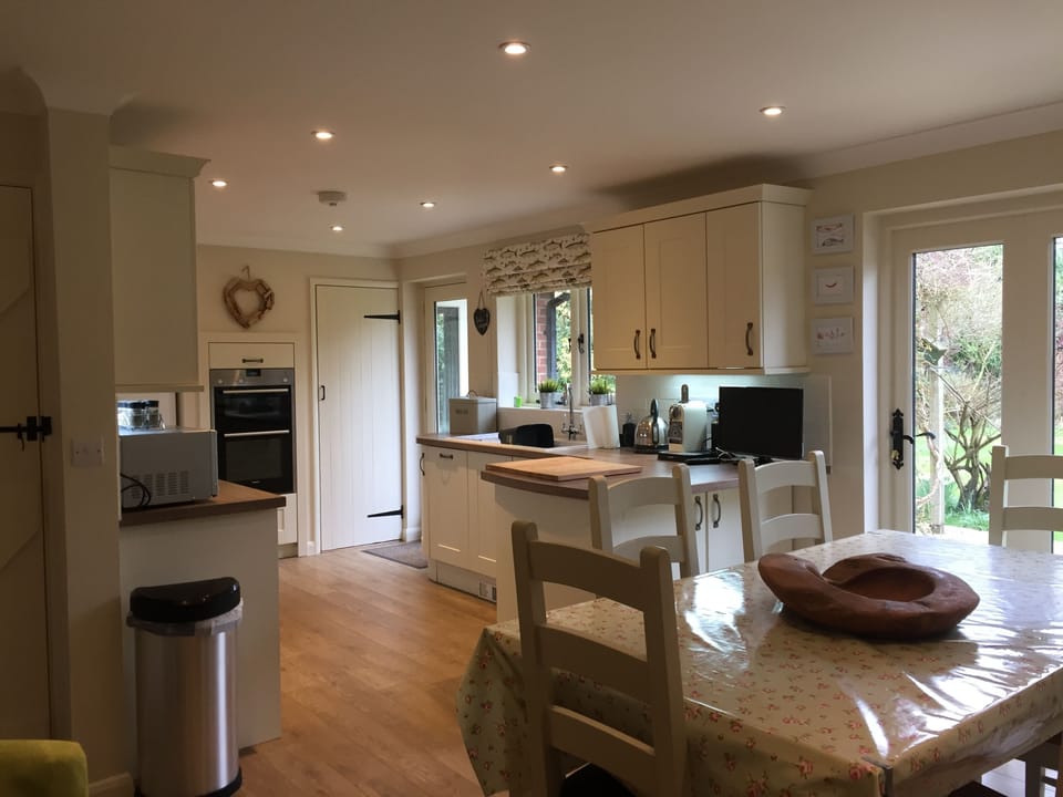 Kitchen-diner with bi-fold doors onto patio