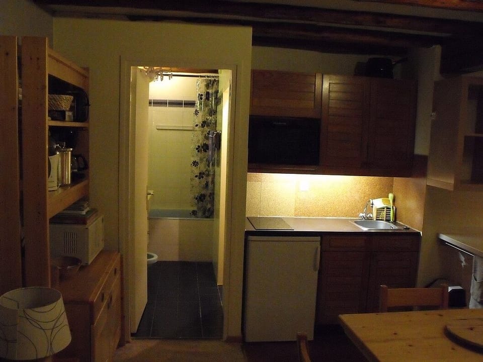 Kitchen area through to bathroom