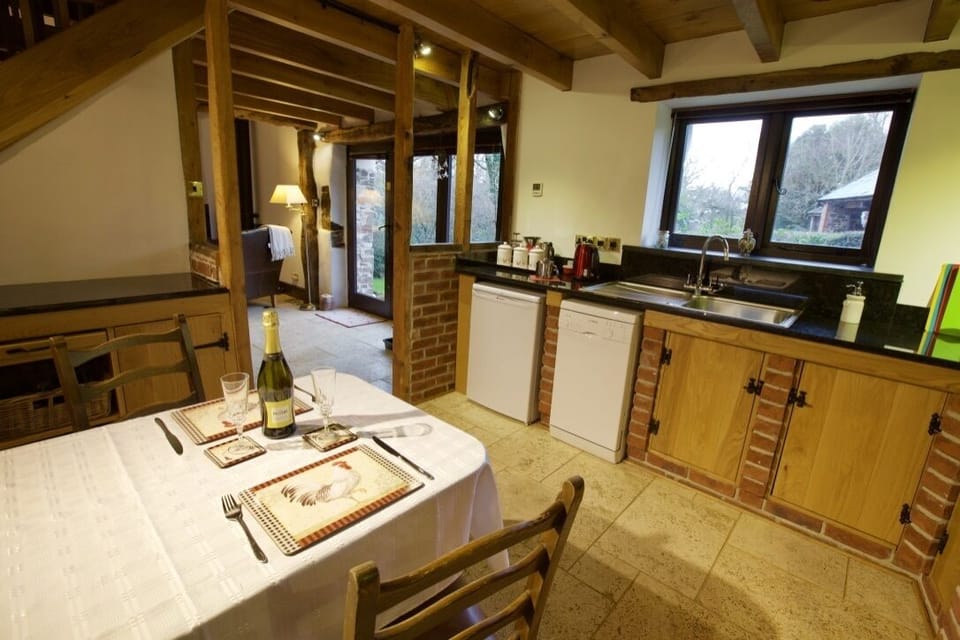 The spacious kitchen looking toward the front door
