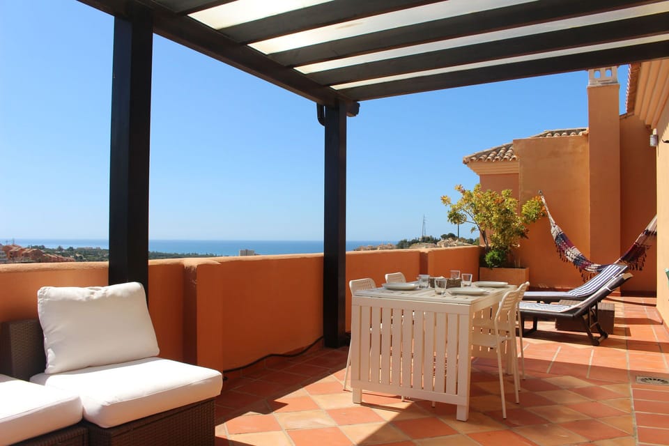 Large terrace with sea and golf views