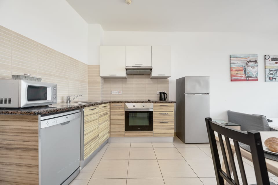 Fully-equipped kitchen with oven, hob, large fridge-freezer and dishwasher