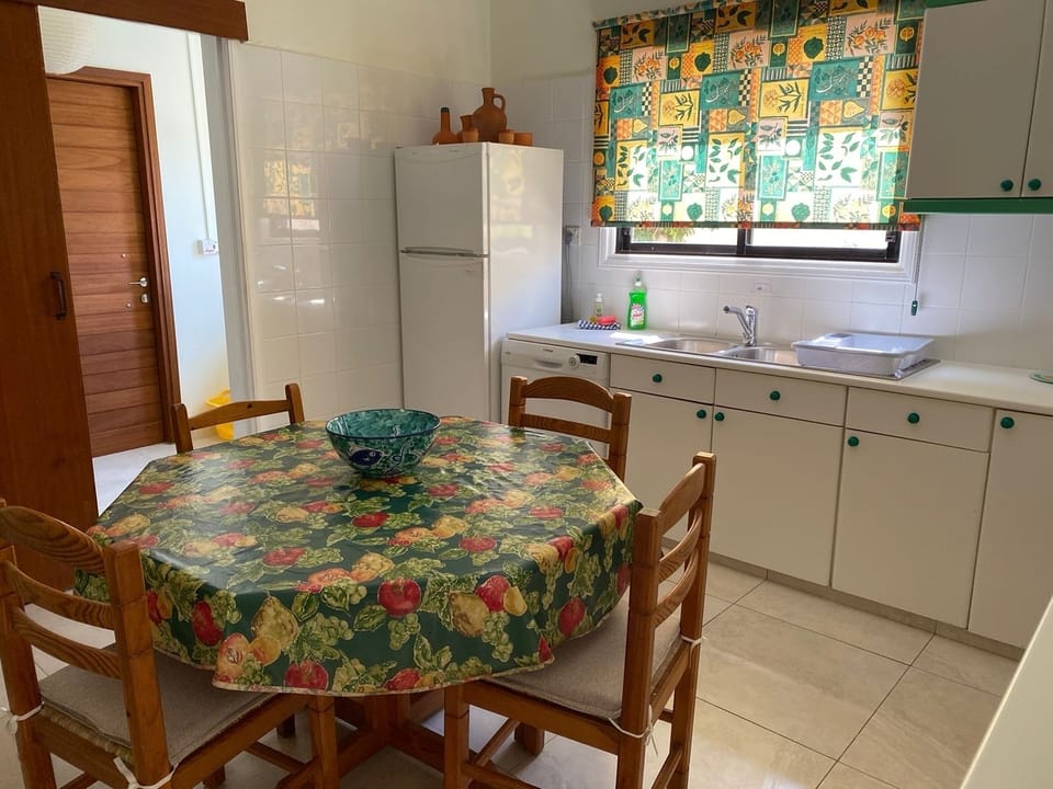 Kitchen leading to our utility room and back door. 