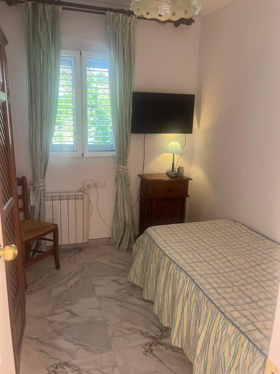 The small bedroom with single bed