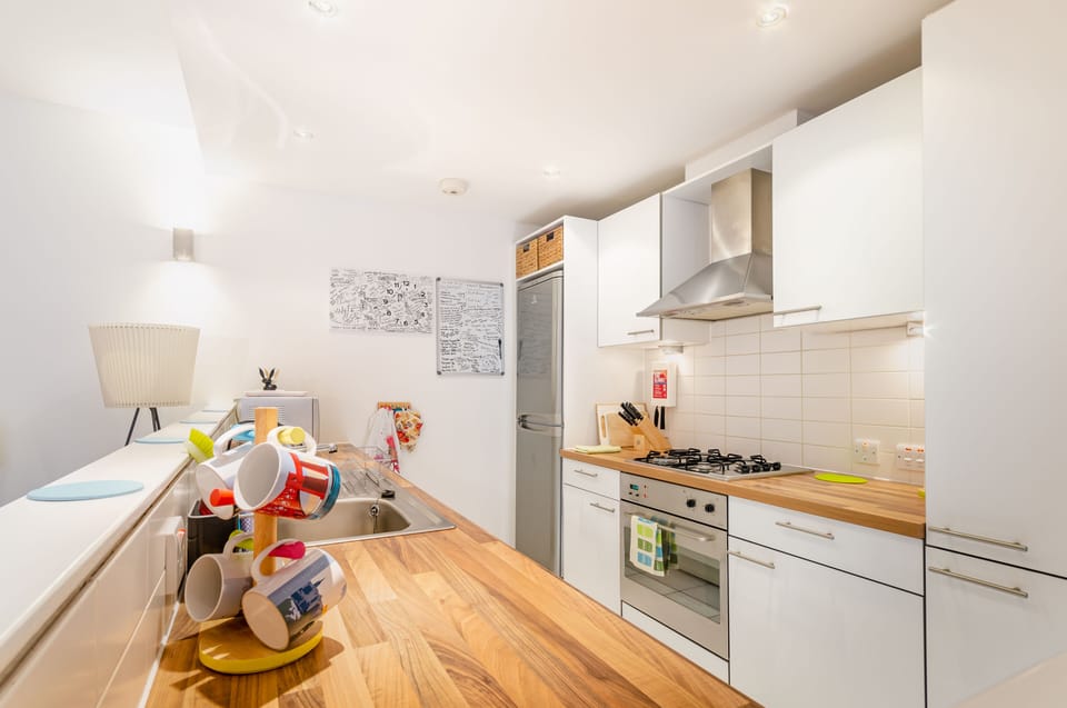 Kitchen has oven, microwave, kettle, toaster, dishwasher and washing machine. 