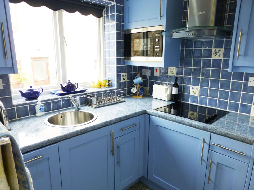 The compact kitchen has every labour-saving device.