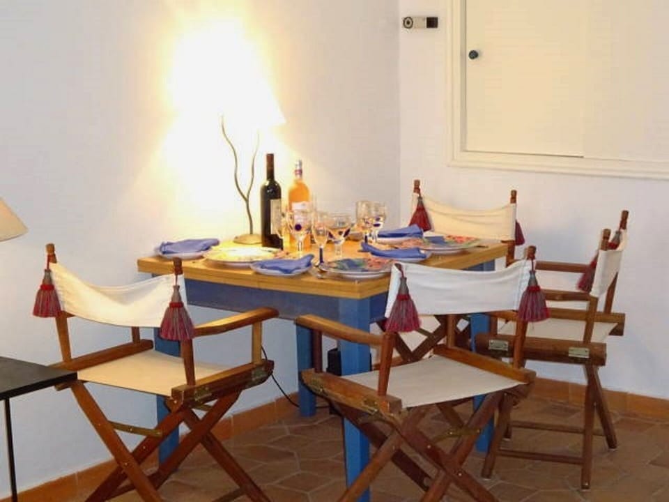 Dining Area, can be expanded to 8. Cupboard doors to kitchen