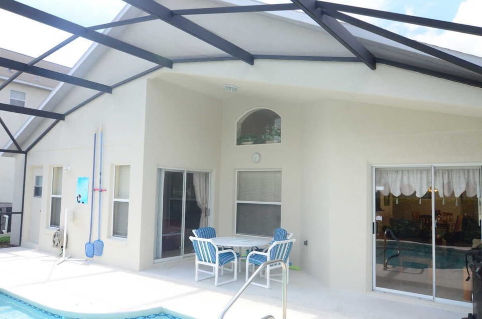 Pool side Lanai. Family area doors on right. Direct to Master bedroom on left