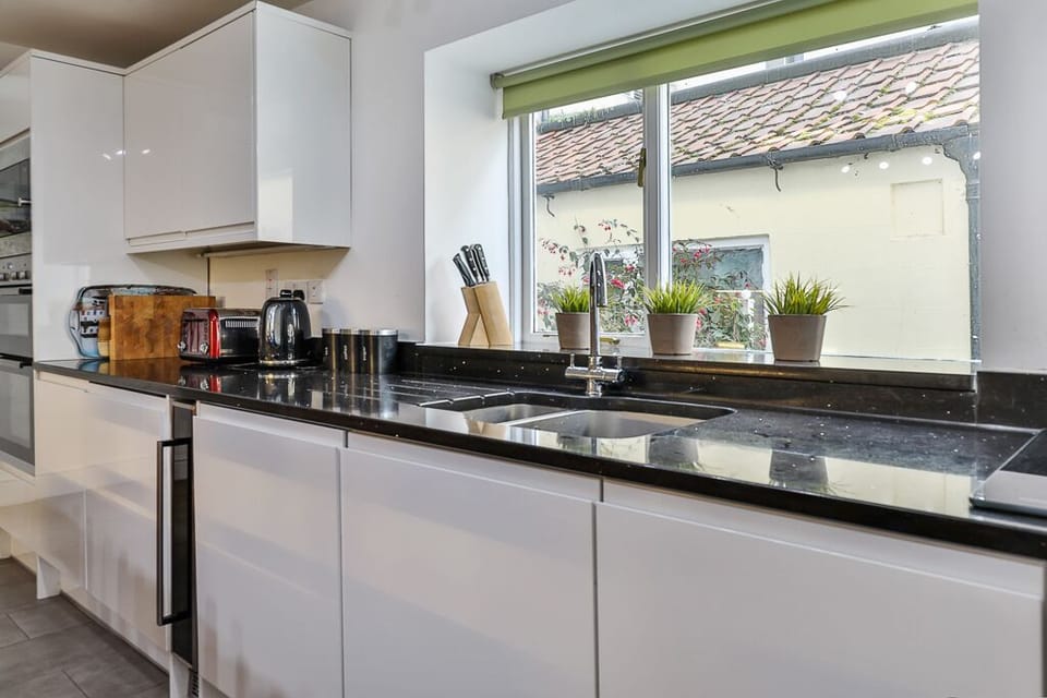 Kitchen:  fridge, double oven, microwave, gas hob, dishwasher, toaster, kettle