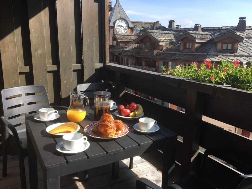 The balcony, breakfast in the summer sun