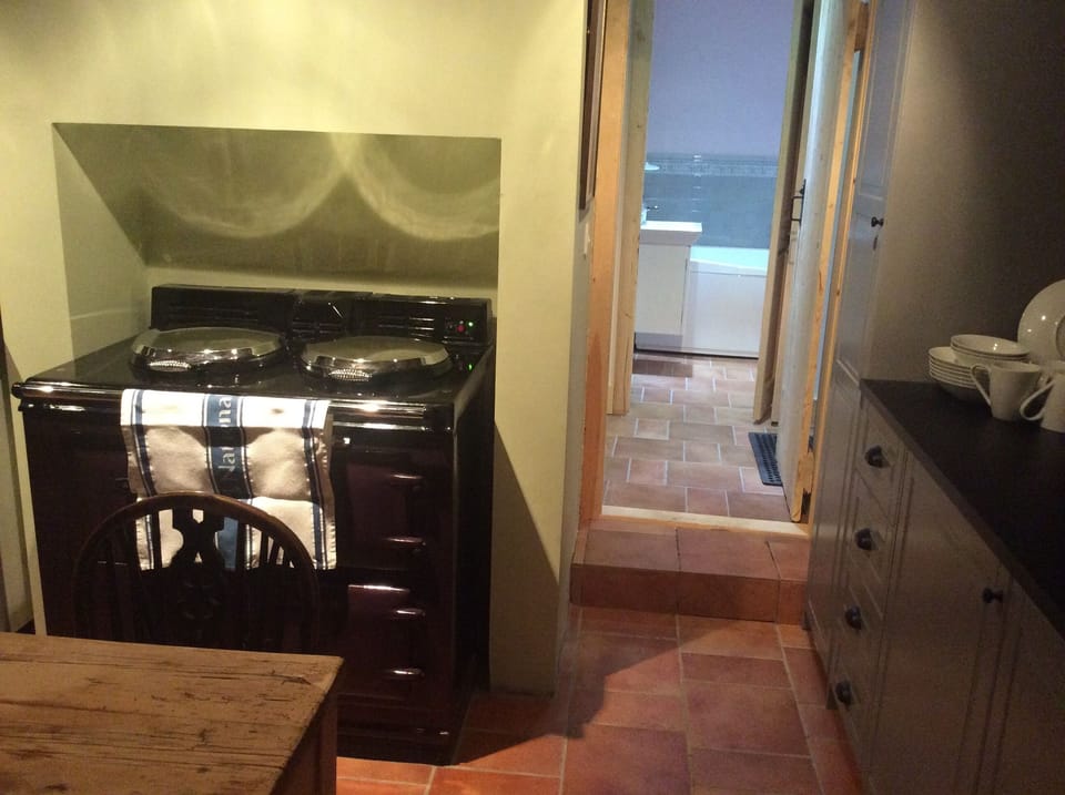 A night storage Aga is wonderful for cooking and keeping the kitchen super warm