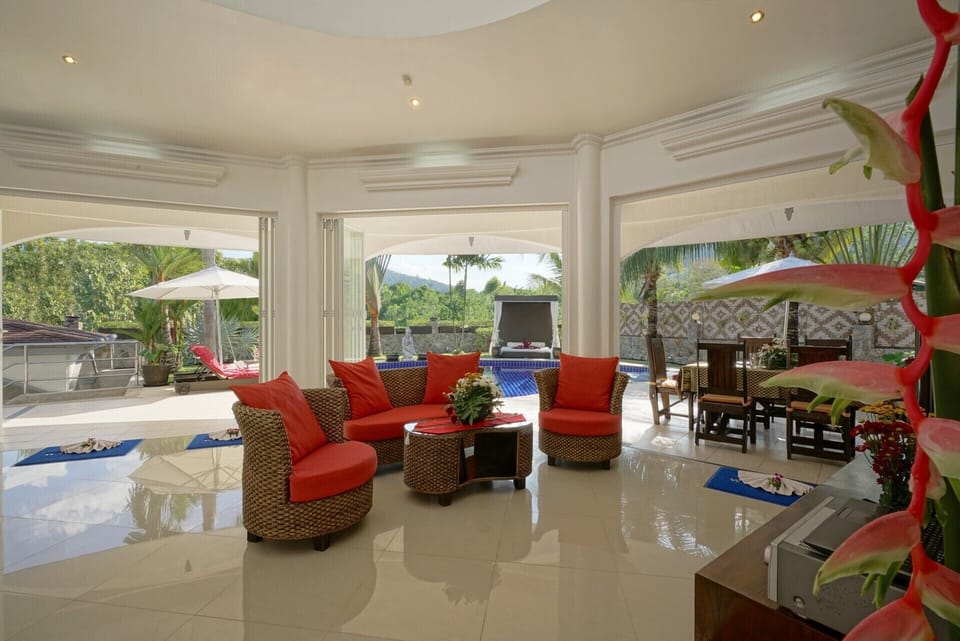 Glass-fronted open plan living room: Relax under a 5m high rooflight dome.