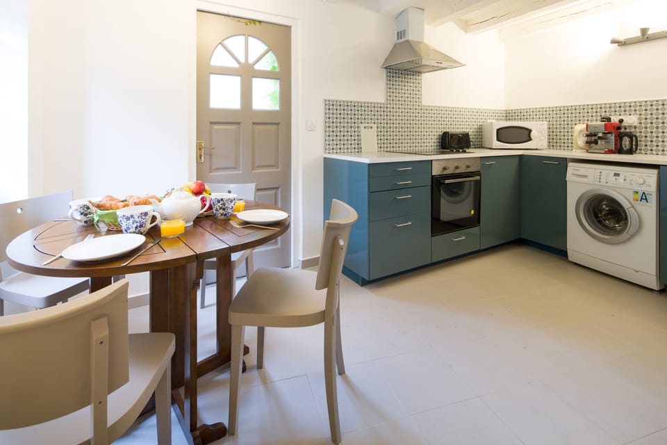 the lovely kitchen with access to the terrace area 