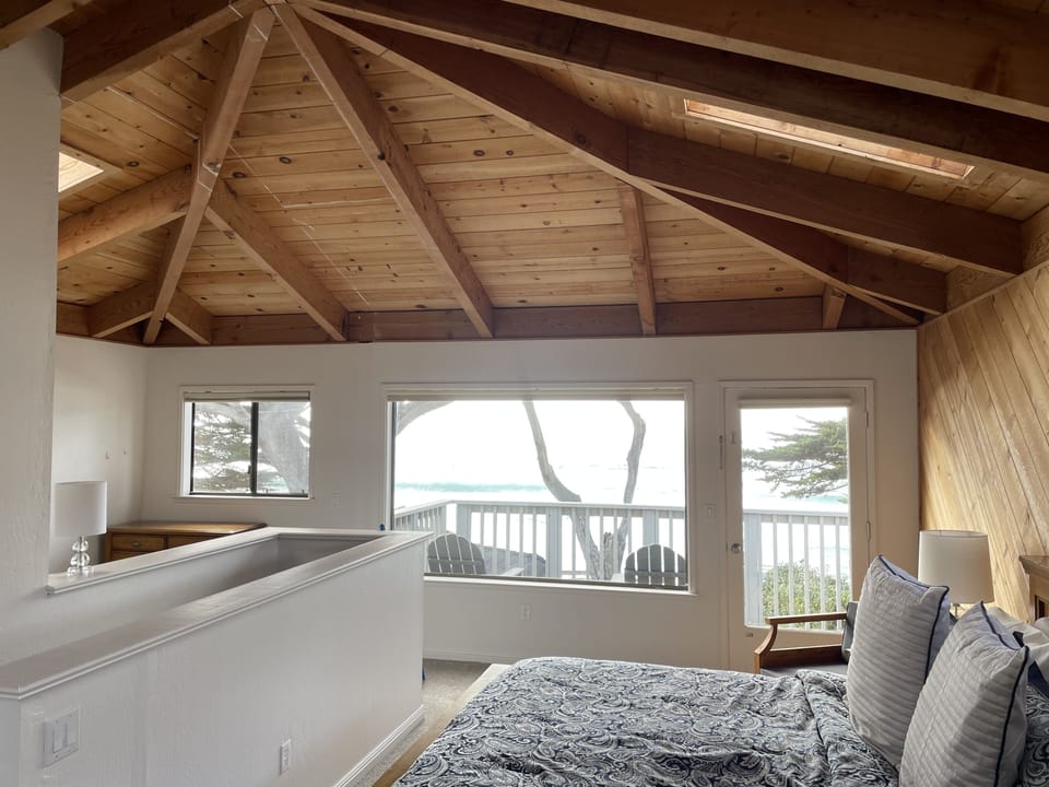 The entire 2nd story is the Master Bedroom with open beam vaulted ceiling