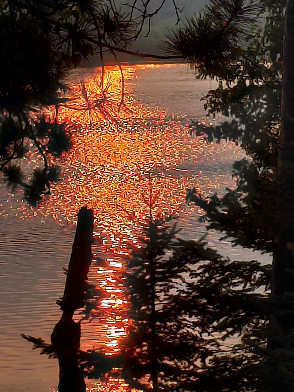 Sunset reflected in the waters of Ocqueoc Lake.