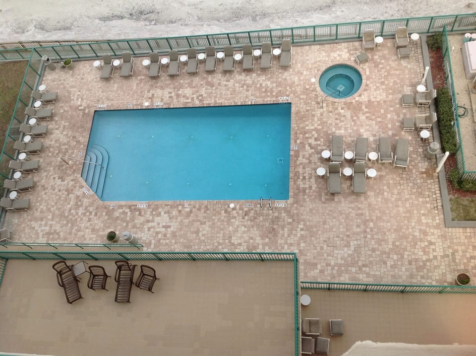 1 of 2 pool/hot tub deck areas