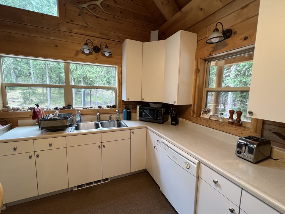 Cabinets contain everything from a popcorn popper to wine glasses + dishwasher!