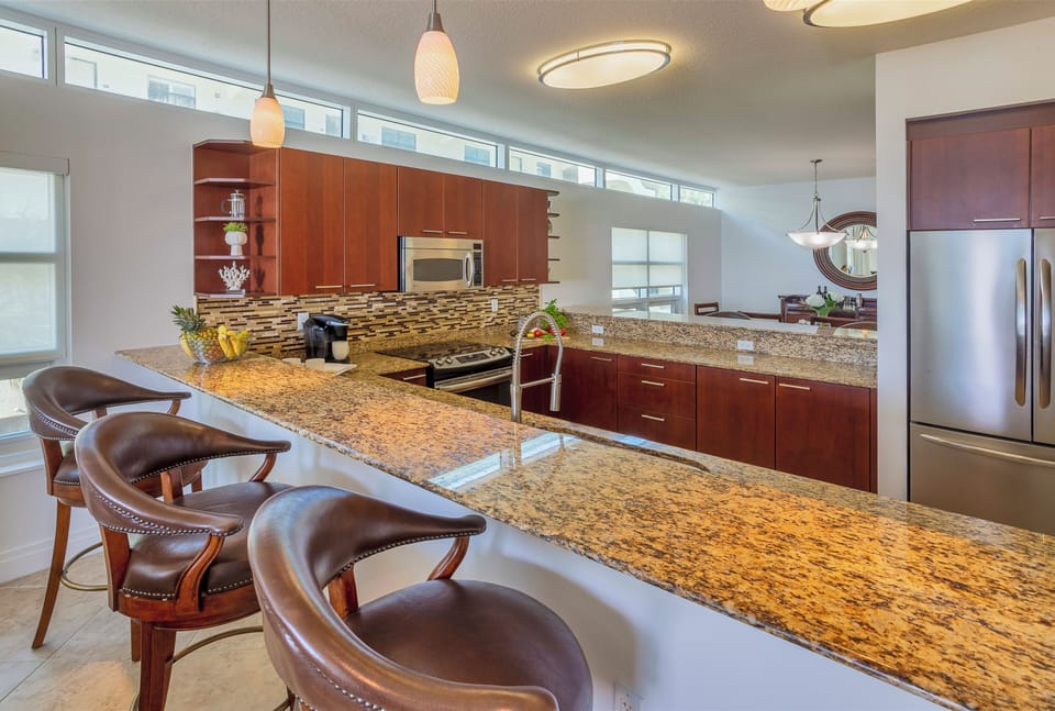 Open and airy kitchen with stainless steel appliances