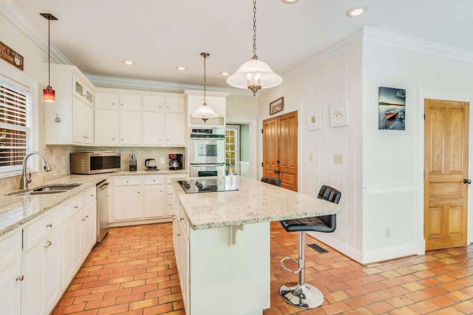 This fully equipped kitchen with stylish finishes and plenty of natural light is perfect for preparing gourmet meals.