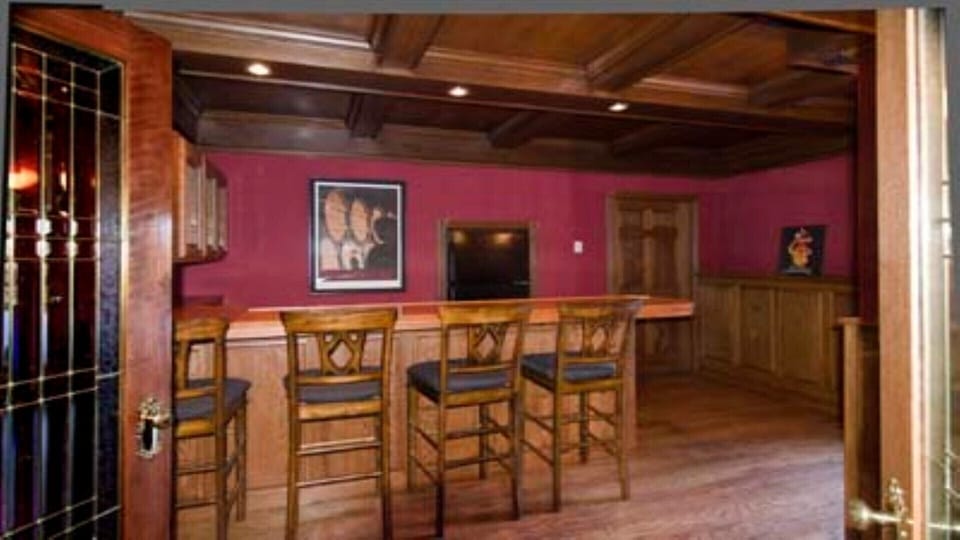 Bar room with an extra fridge and plenty of work space. 