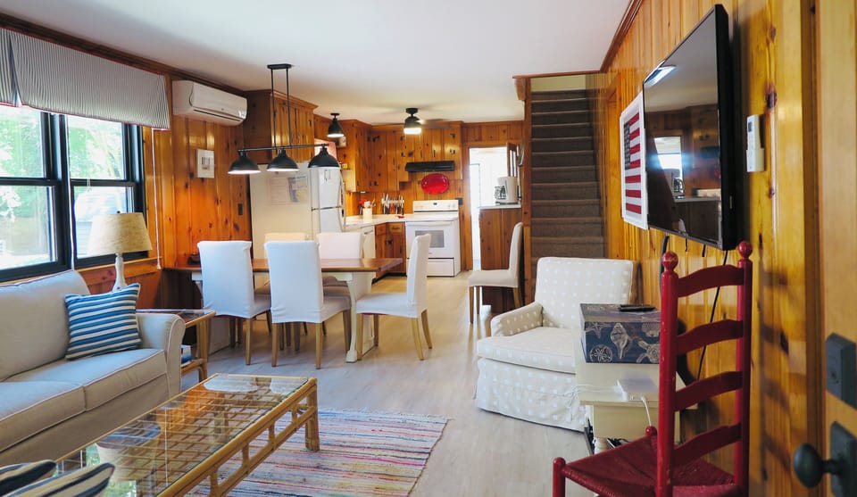 Living room, dining area, kitchen.