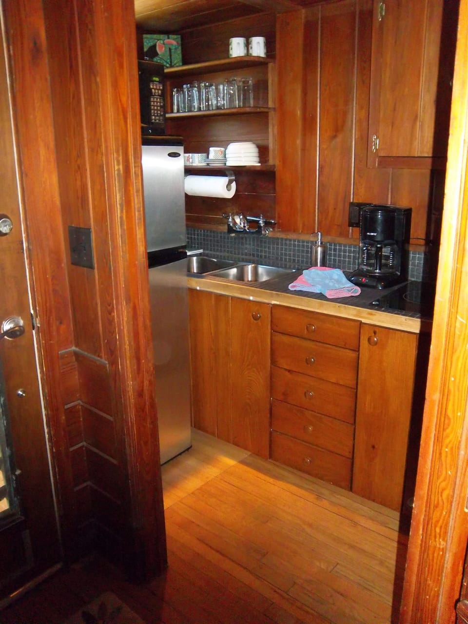 view from hallway looking left into galley kitchen