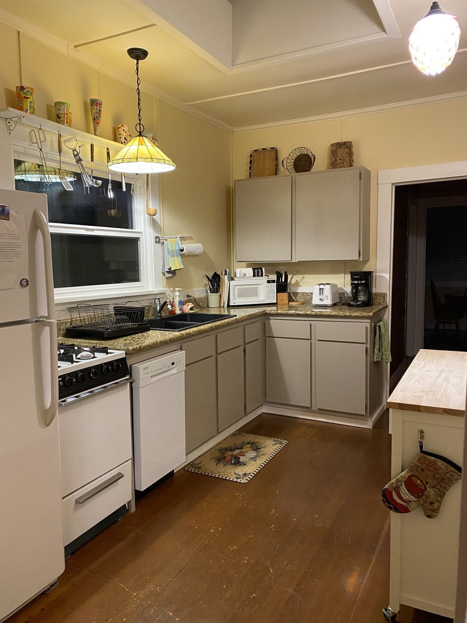 Updated kitchen with gas stove and granite counters.