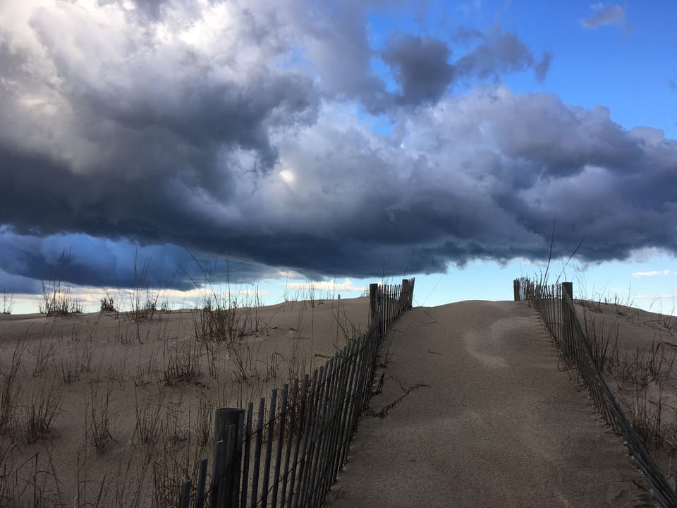 Interesting sky from walkway to the beach
