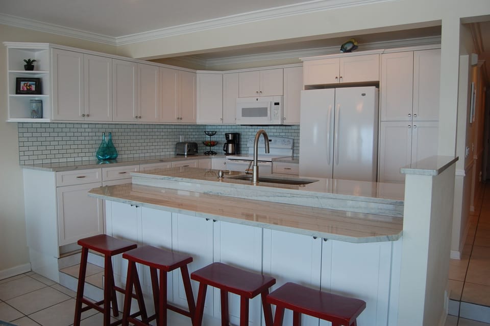 New in 2015 - custom cabinets, countertops, backsplash, sink and faucet.