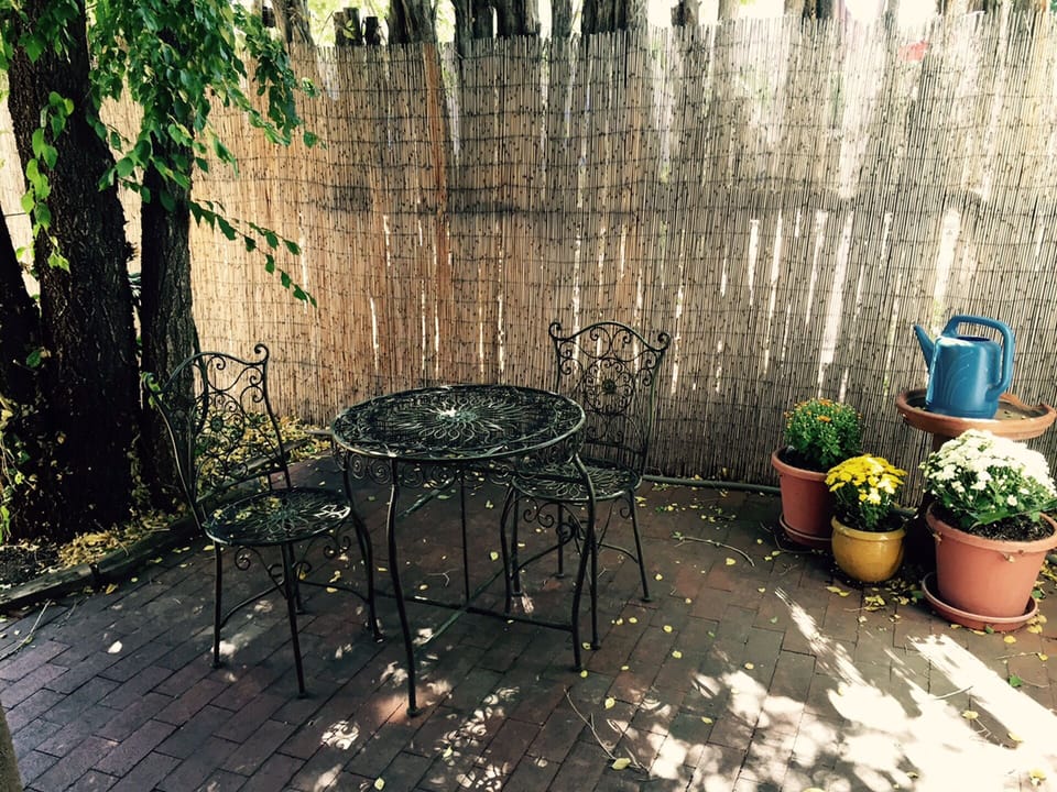 The small front patio is a great spot for coffee.