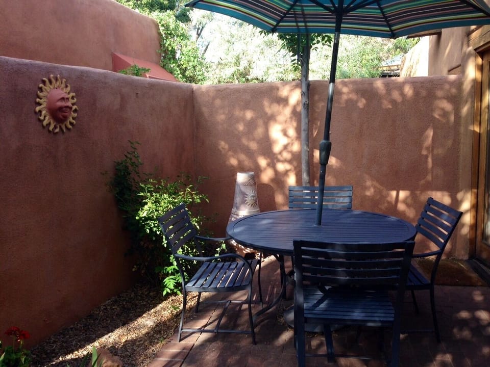 Sunny & tranquil back patio with gas grill and chiminea.