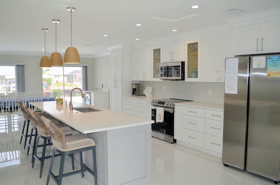 All new kitchen; island, appliances, cabinets, floors, lighting, everything. 