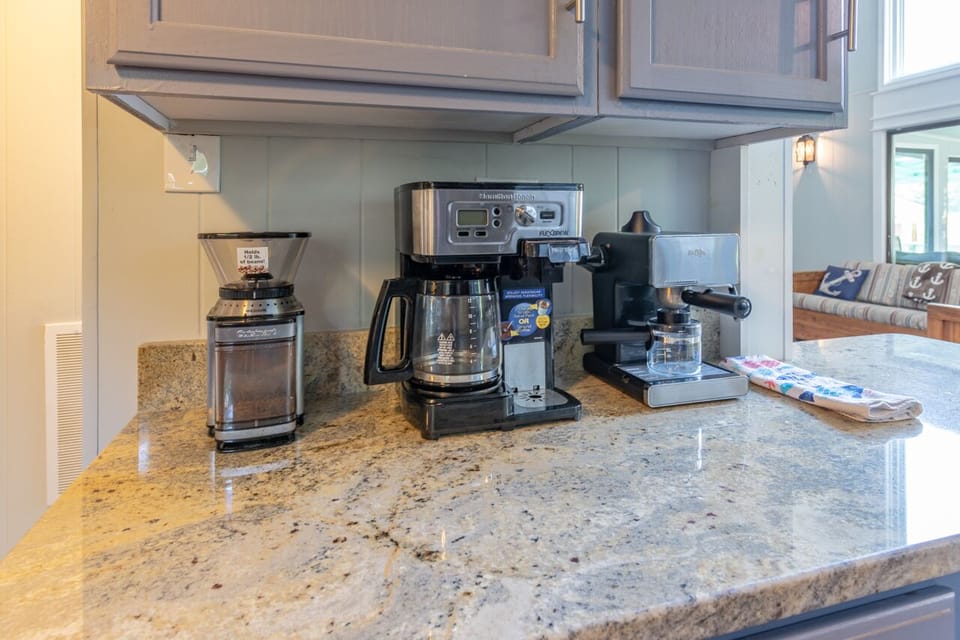 coffee grinder, espresso machine and coffee pot available for your use.