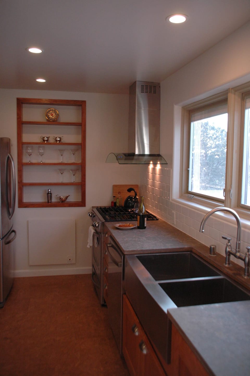 galley kitchen with updated cookware