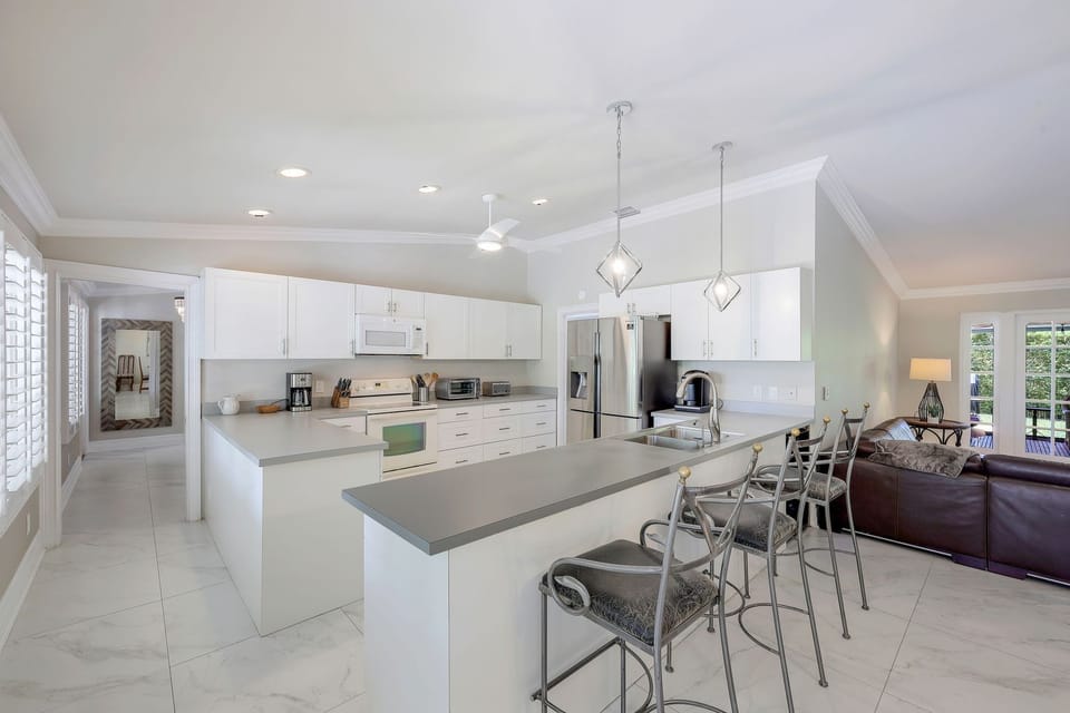 Spacious open kitchen/family room area with vaulted ceilings