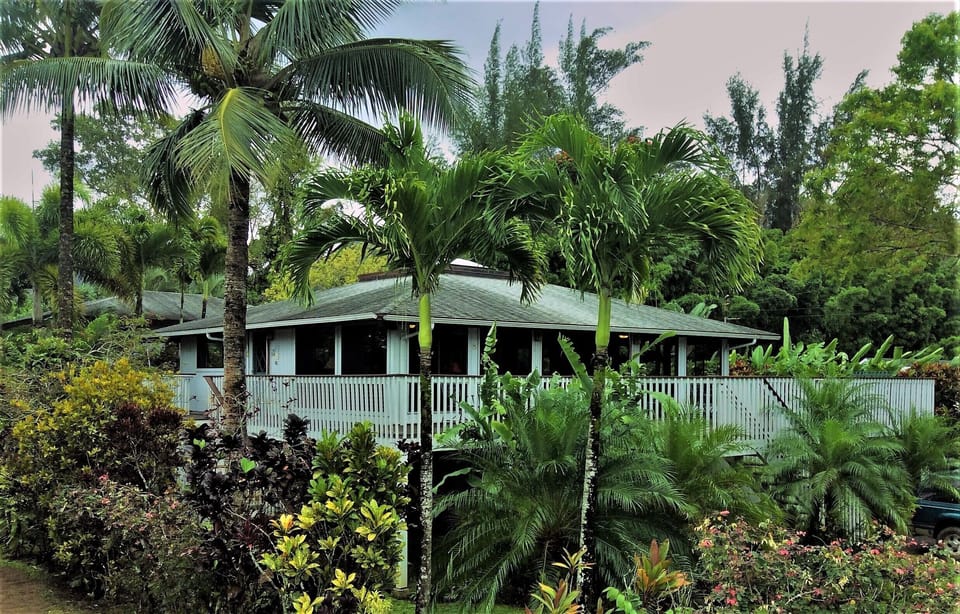 This 4 BR, 5 bath home with huge deck and yard is close to both beach and town