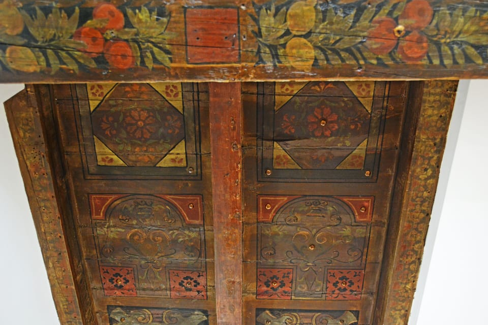 17th century painted wooden ceiling in the dining area