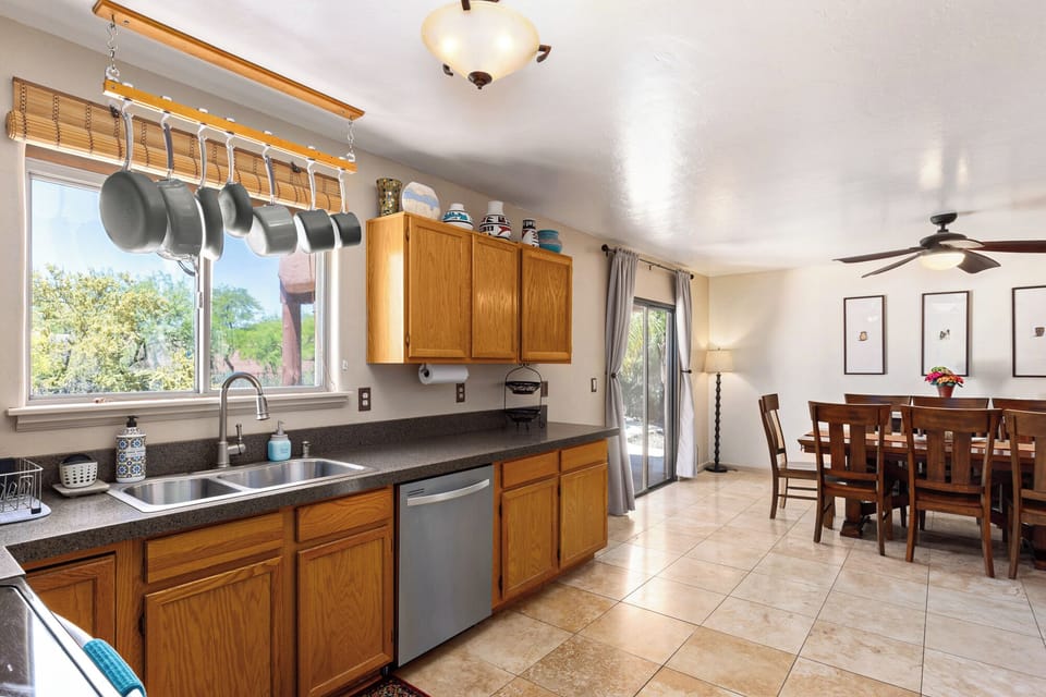 Spacious open plan kitchen a dining area overlooking the pool