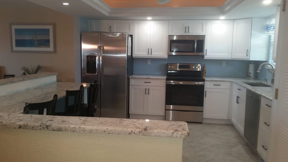 Beautiful new custom kitchen fully stocked and enhanced lighting.