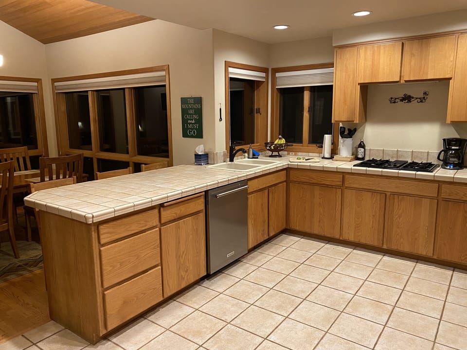 Spacious kitchen with gas stove, industrial dishwasher & many cooking amenities.