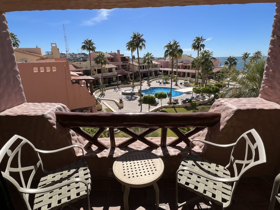 Patio with 3 chairs and small table