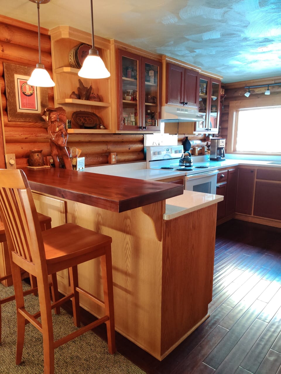 Breakfast bar, small ice chests in the cupboard below