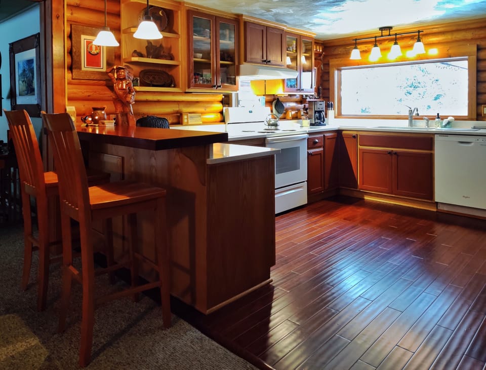 Kitchen with picture window to the yarden