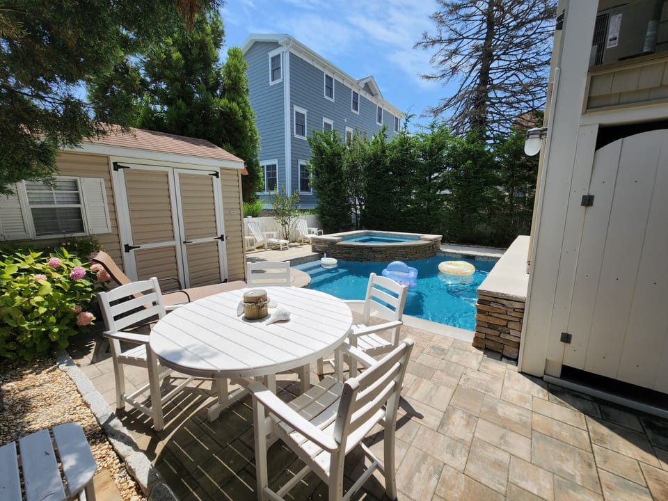 Rear Pool Area with Dining Area & Multiple Sun Loungers